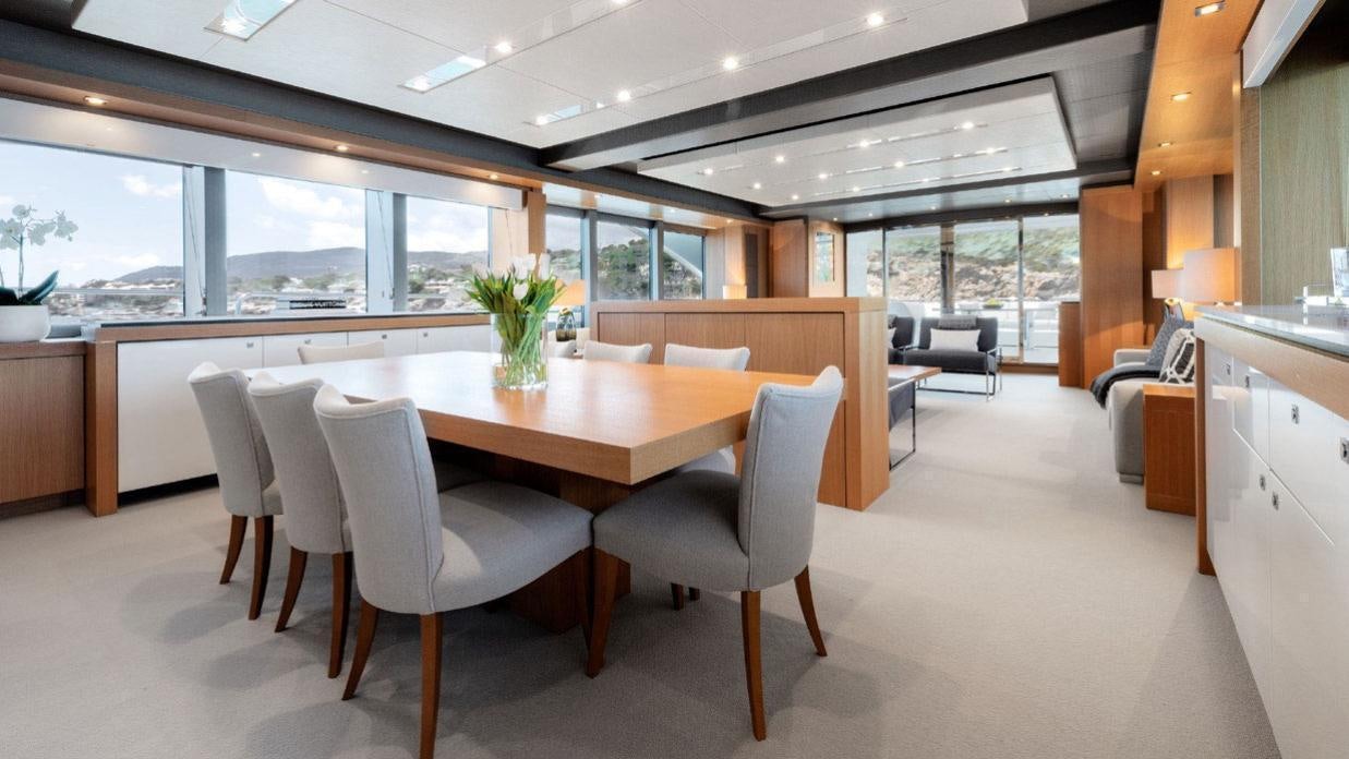 a large kitchen with a large table aboard OKSANCHIK Yacht for Charter