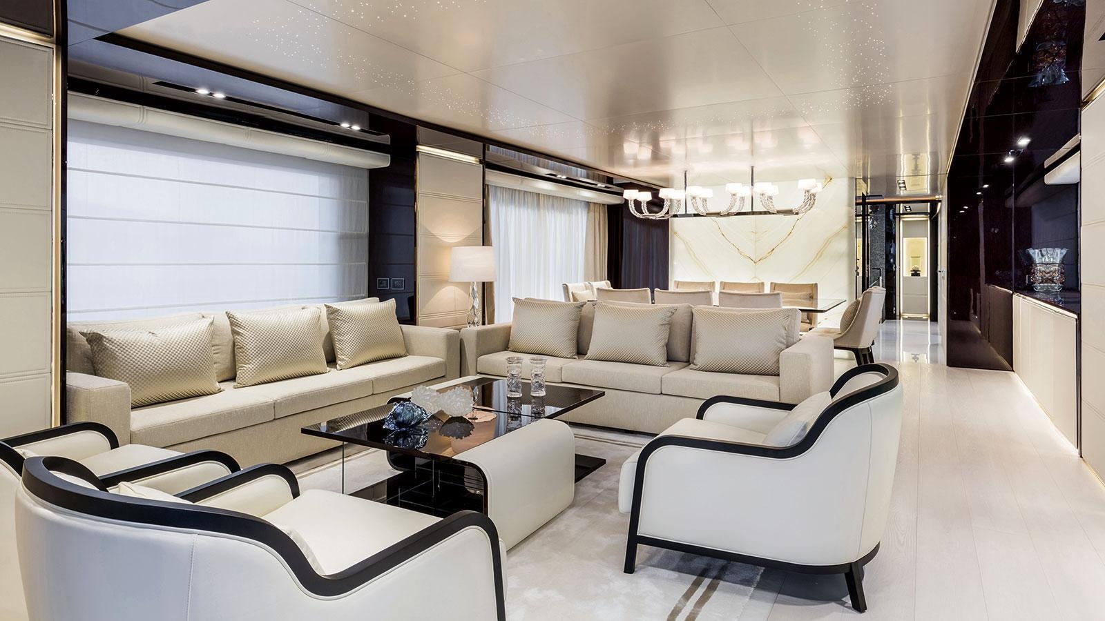 a living room with white furniture aboard SOULMATE Yacht for Charter
