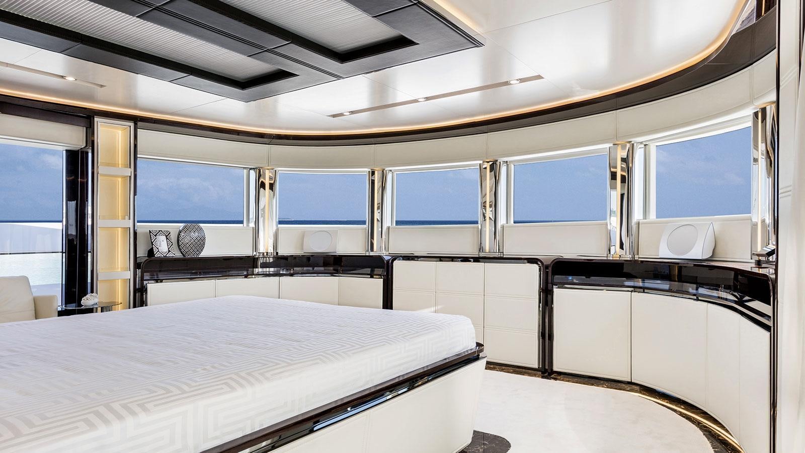 a room with a bed and desk aboard SOULMATE Yacht for Charter