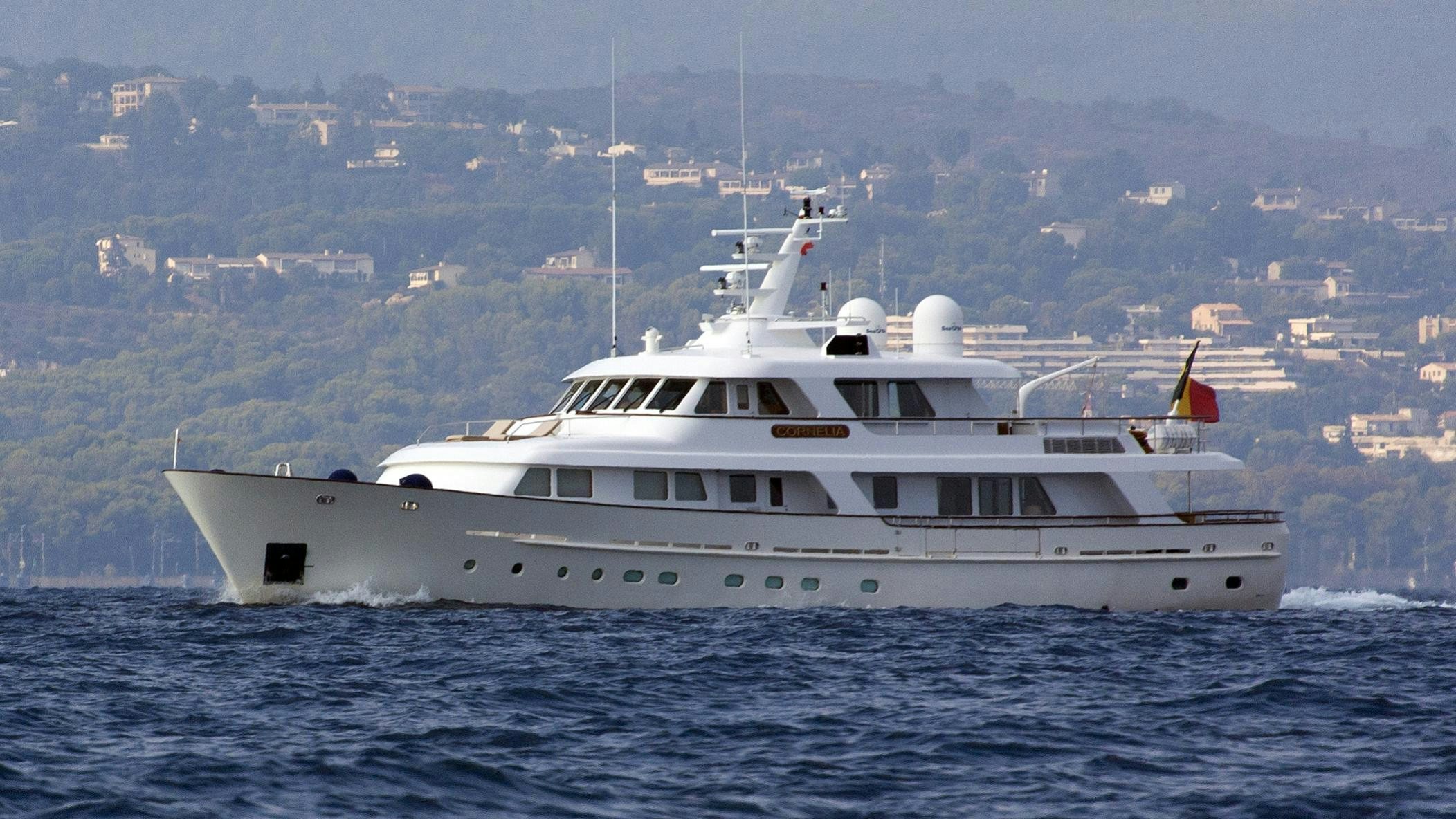 a large white boat in the water aboard CORNELIA Yacht for Charter