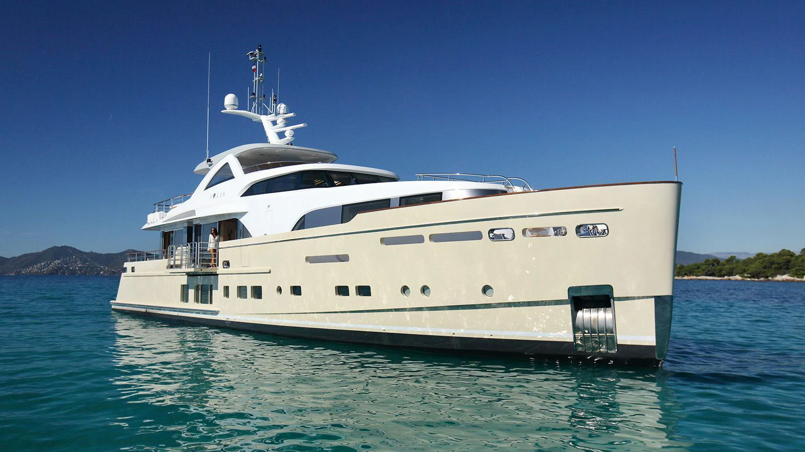 a large white yacht in the water aboard SOLIS Yacht for Charter
