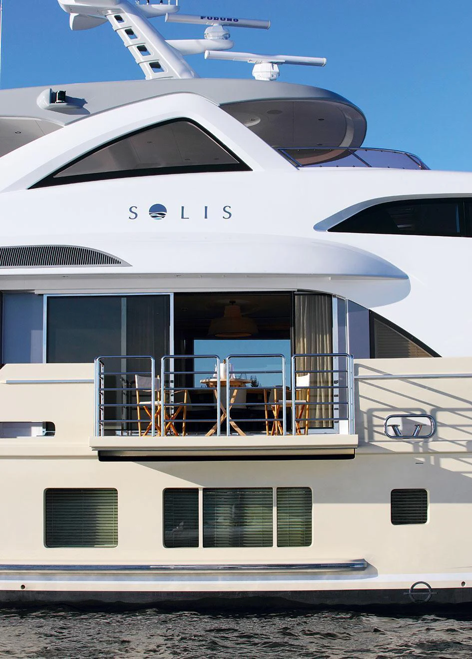 a white yacht with a balcony aboard SOLIS Yacht for Charter