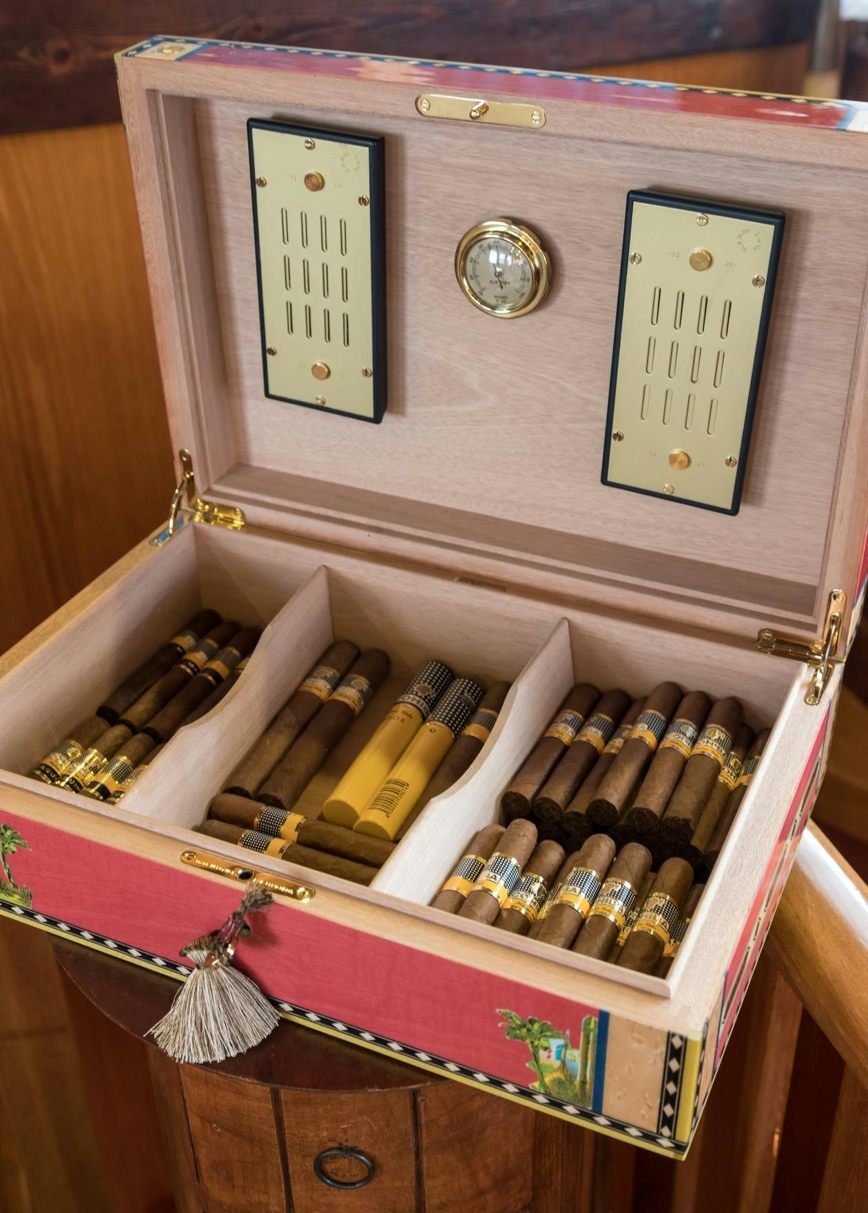 a shelf with a variety of wine bottles aboard OVER THE RAINBOW OF LONDON Yacht for Charter