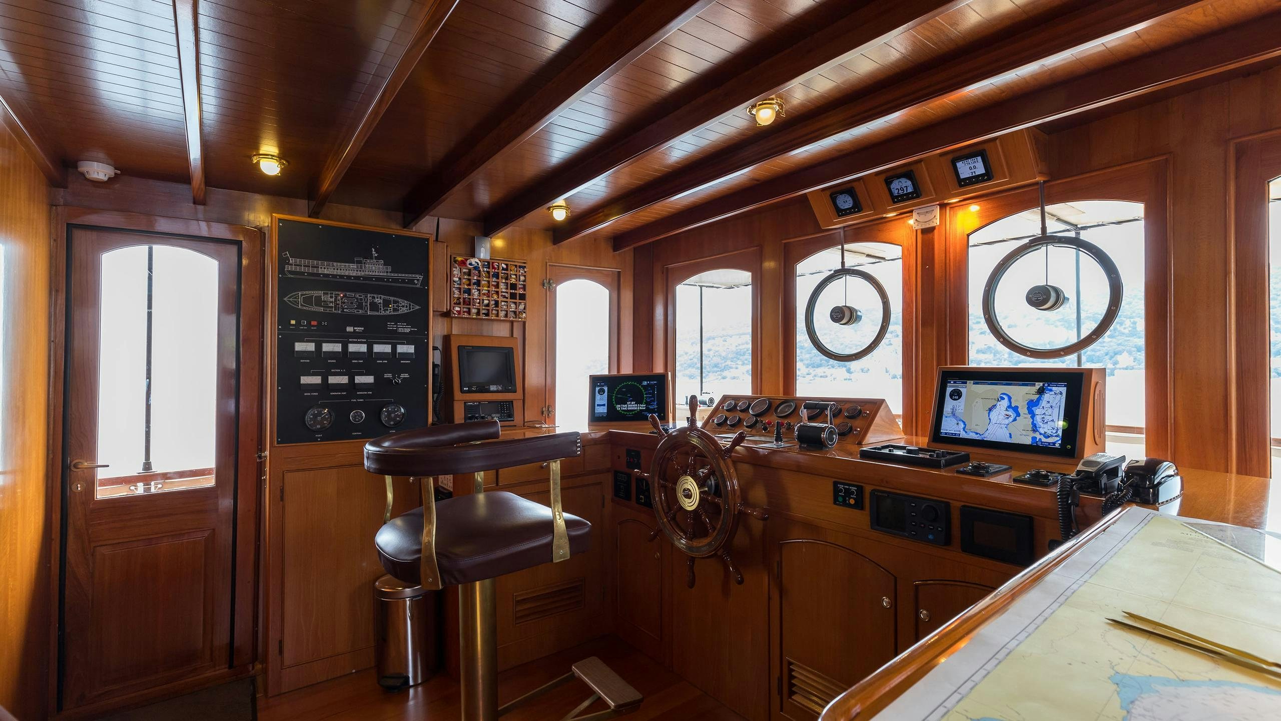 a room with a desk and chairs aboard OVER THE RAINBOW OF LONDON Yacht for Charter