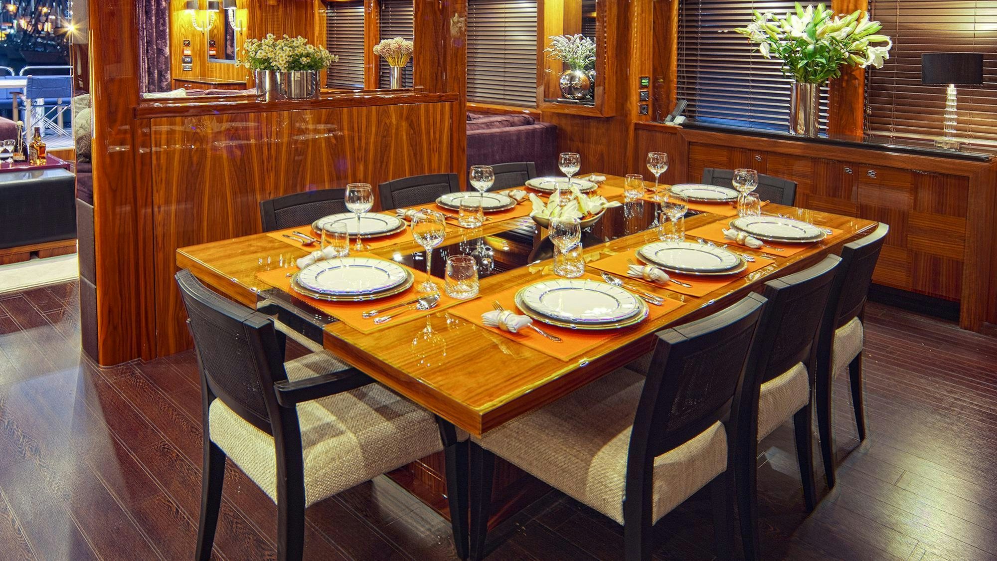 a dining table set for a dinner aboard ARAGO Yacht for Charter
