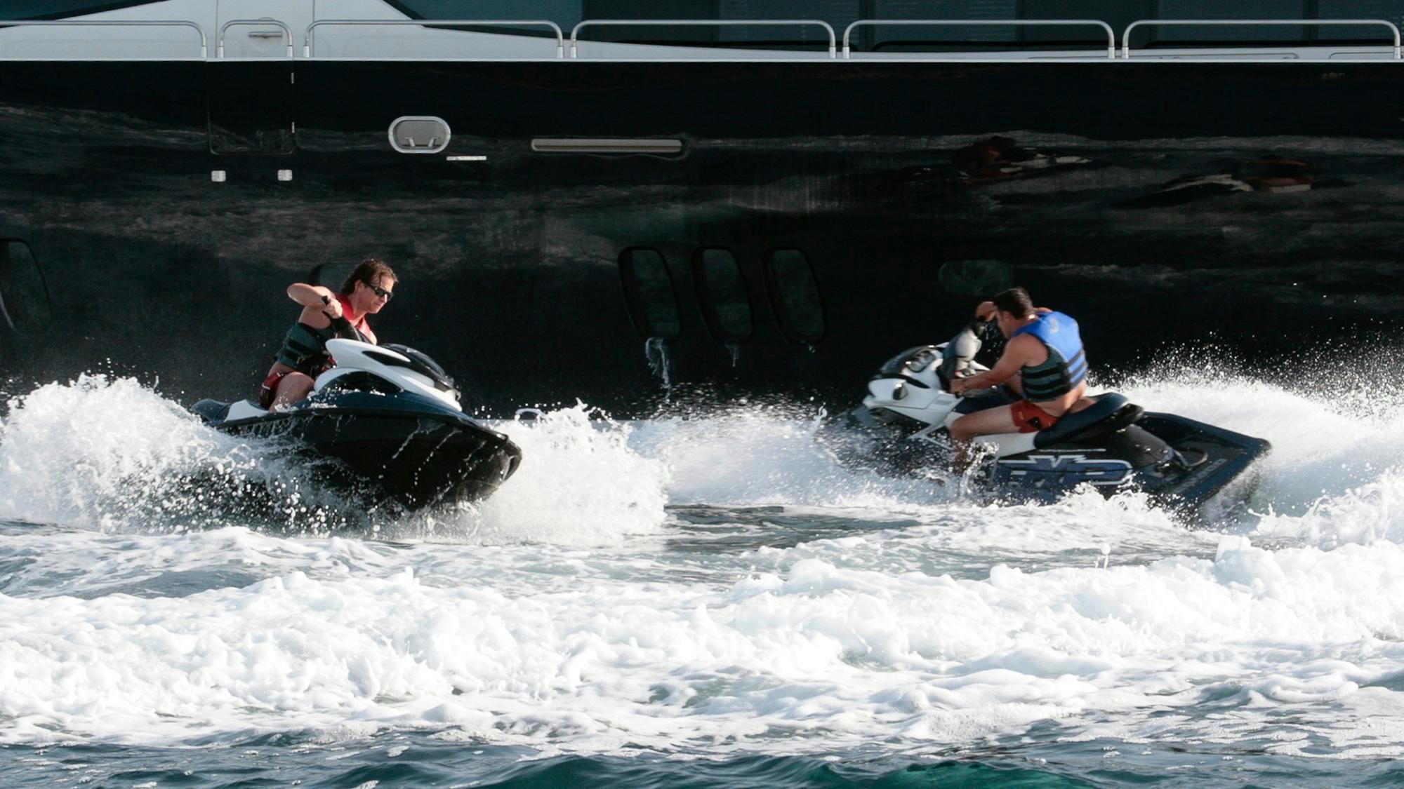 people on a jet ski aboard ARAGO Yacht for Charter