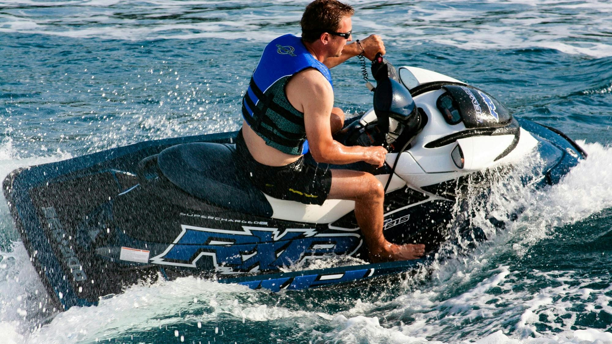 a man on a jet ski aboard ARAGO Yacht for Charter