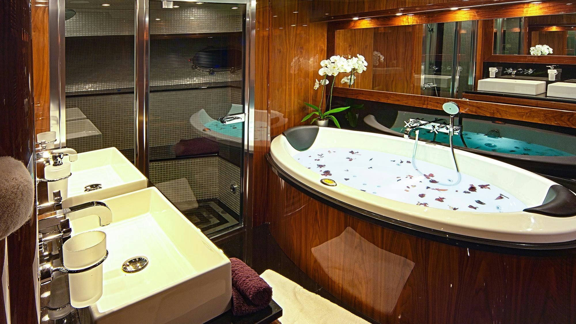 a kitchen with a sink and a mirror aboard ARAGO Yacht for Charter
