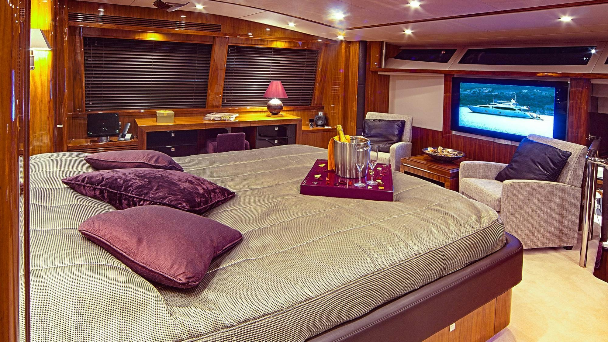 a large bed in a room aboard ARAGO Yacht for Charter