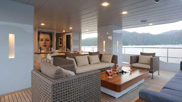 a living room with a large window aboard ONLY NOW Yacht for Charter