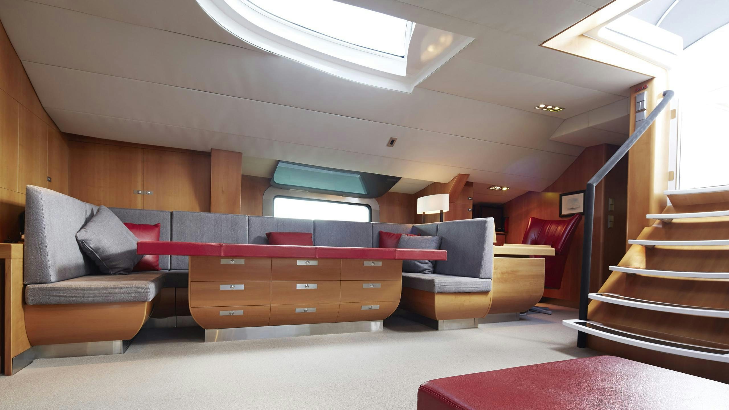 a room with a couch and a staircase aboard SILVERTIP Yacht for Charter