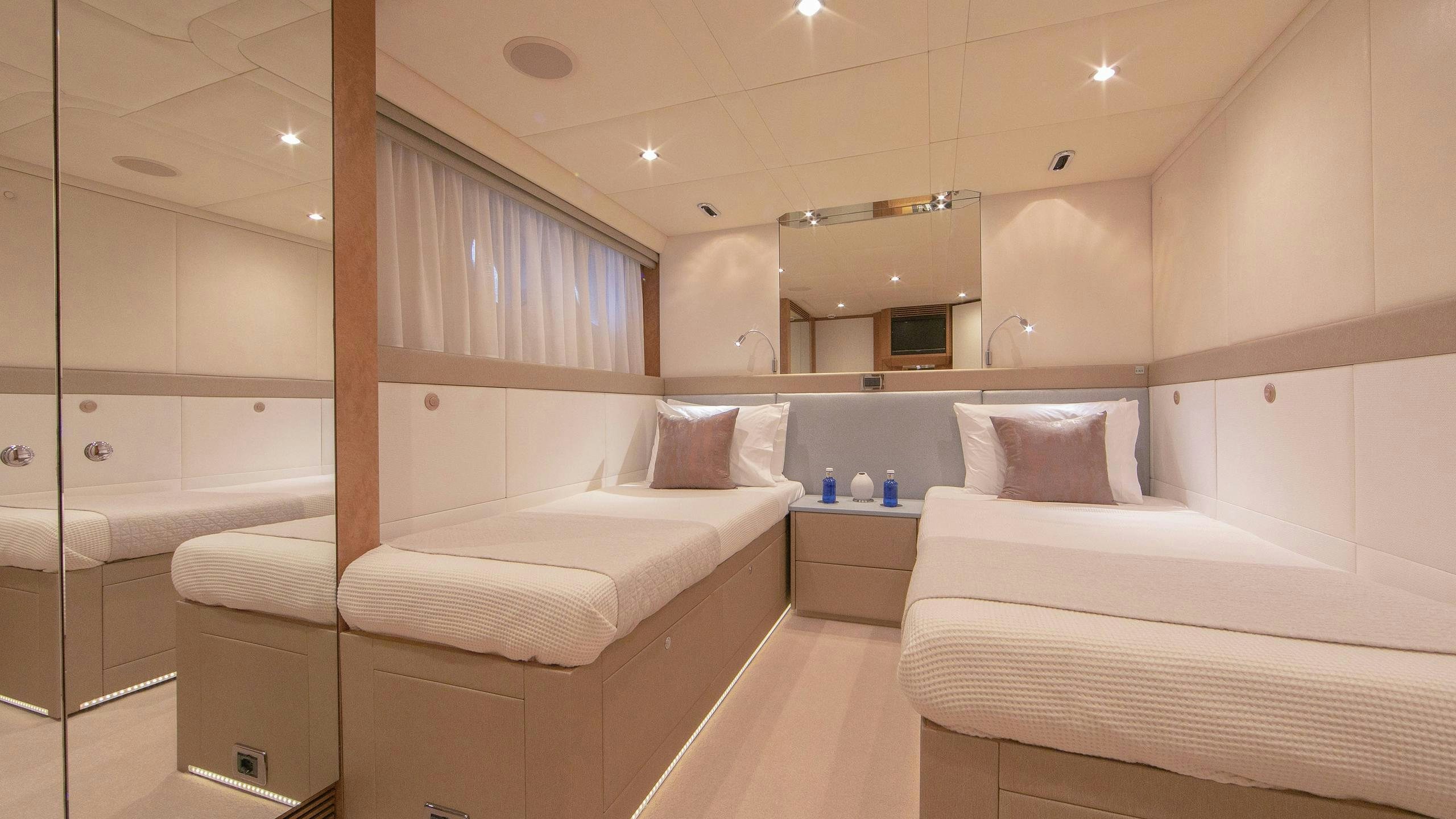 a room with a couple of beds aboard BENITA BLUE Yacht for Charter