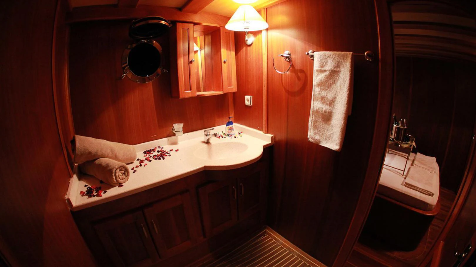 a bathroom with a sink and towels aboard JUNIOR ORCUN Yacht for Charter