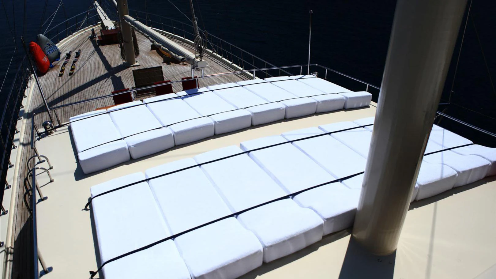 a white boat in a large body of water aboard JUNIOR ORCUN Yacht for Charter