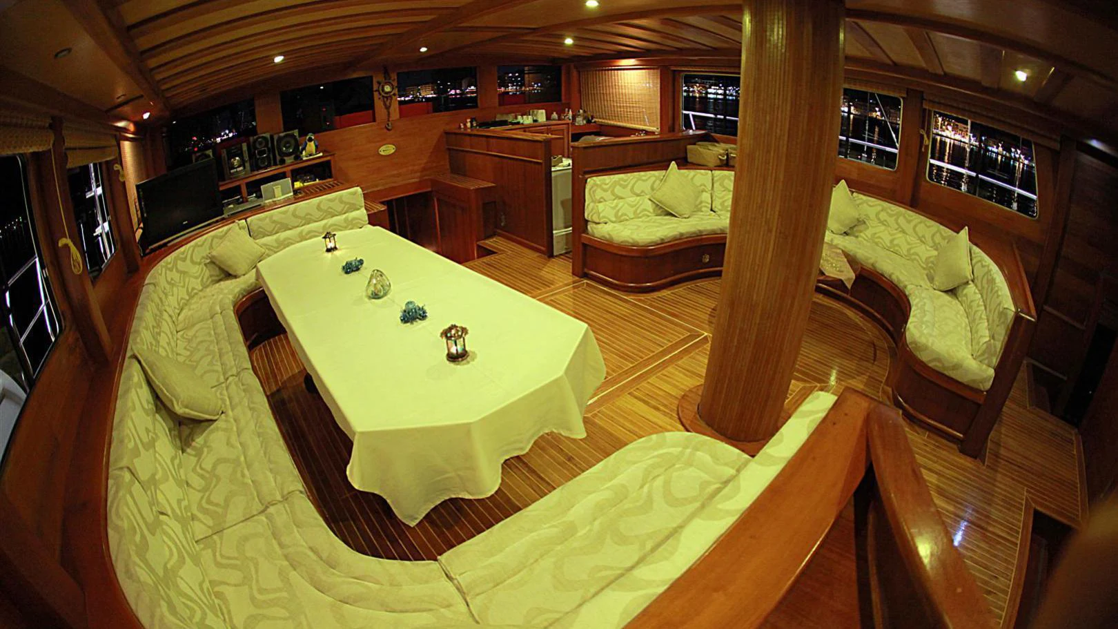 a room with a table and chairs aboard JUNIOR ORCUN Yacht for Charter