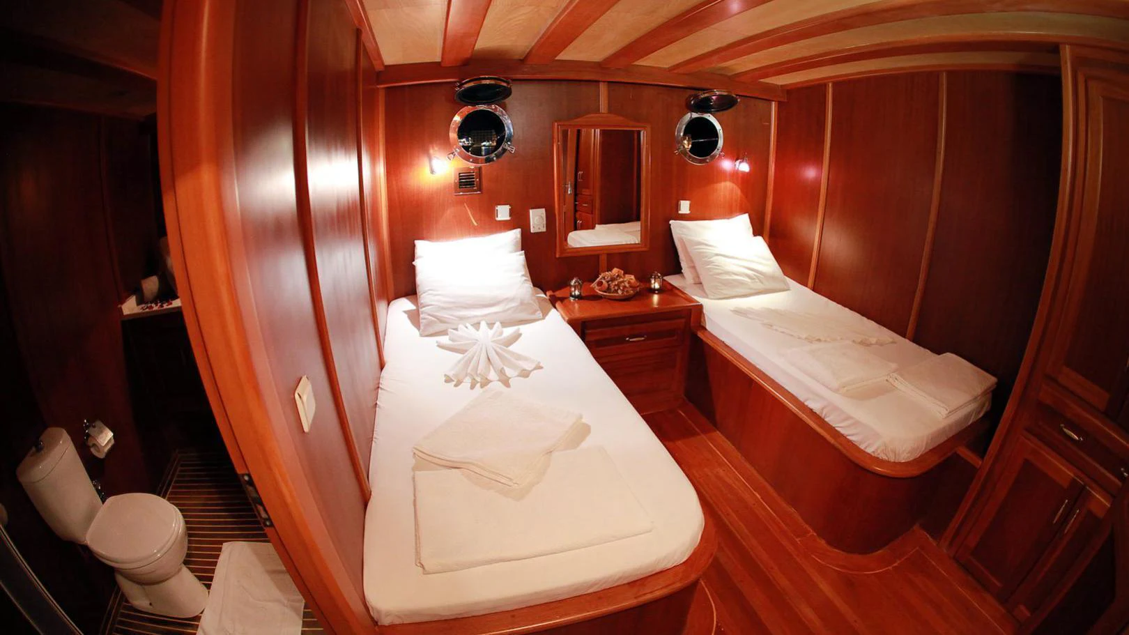 a couple of beds in a room aboard JUNIOR ORCUN Yacht for Charter