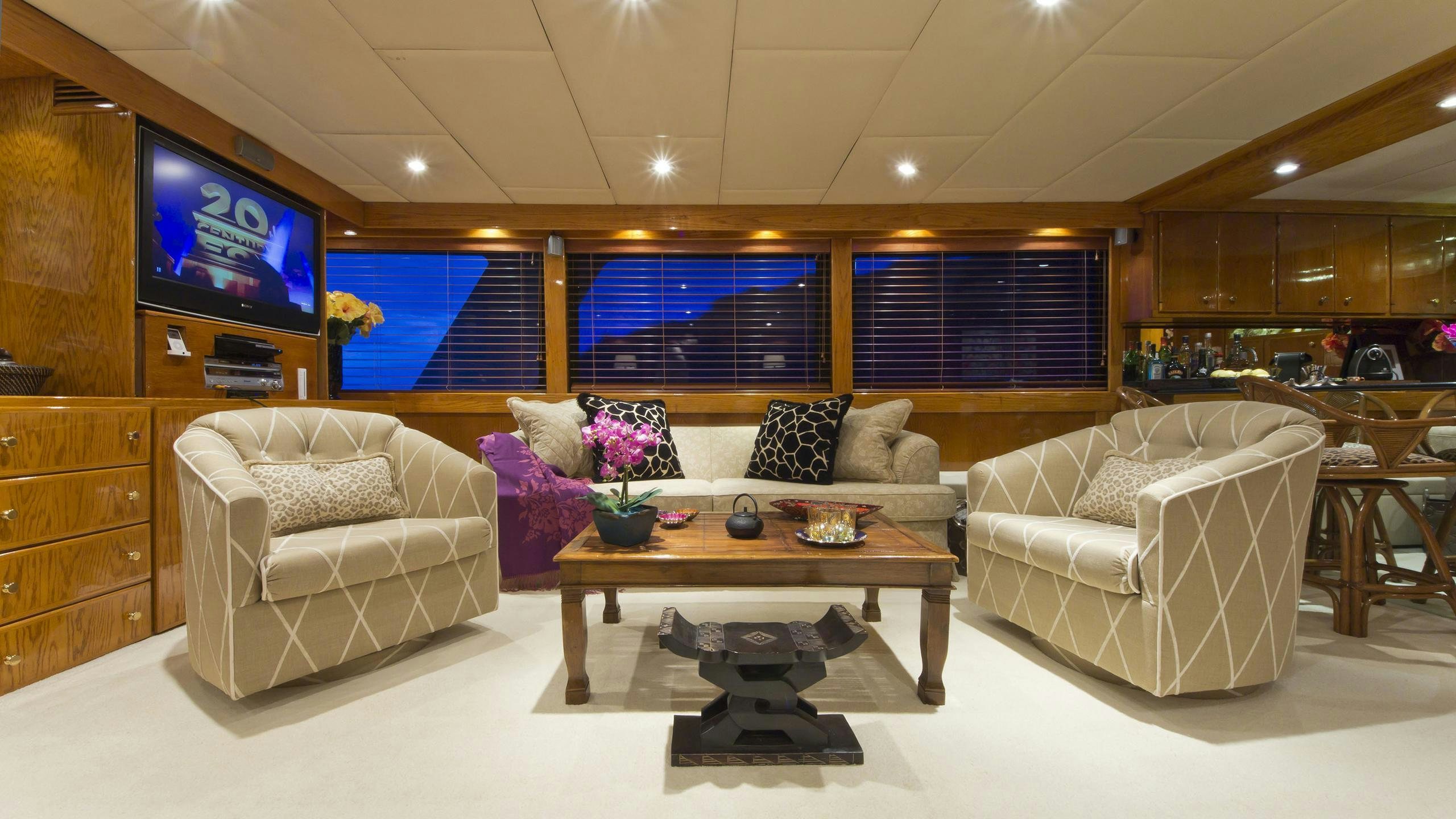 a living room with a large tv aboard ASKARI Yacht for Charter