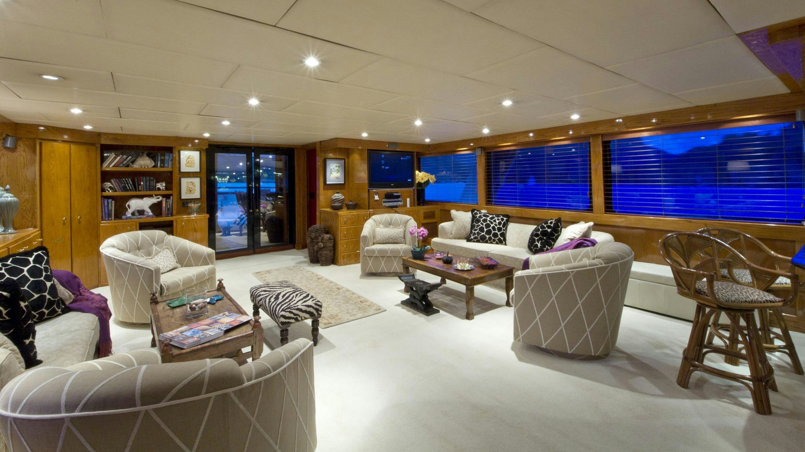 a living room with a large window aboard ASKARI Yacht for Charter