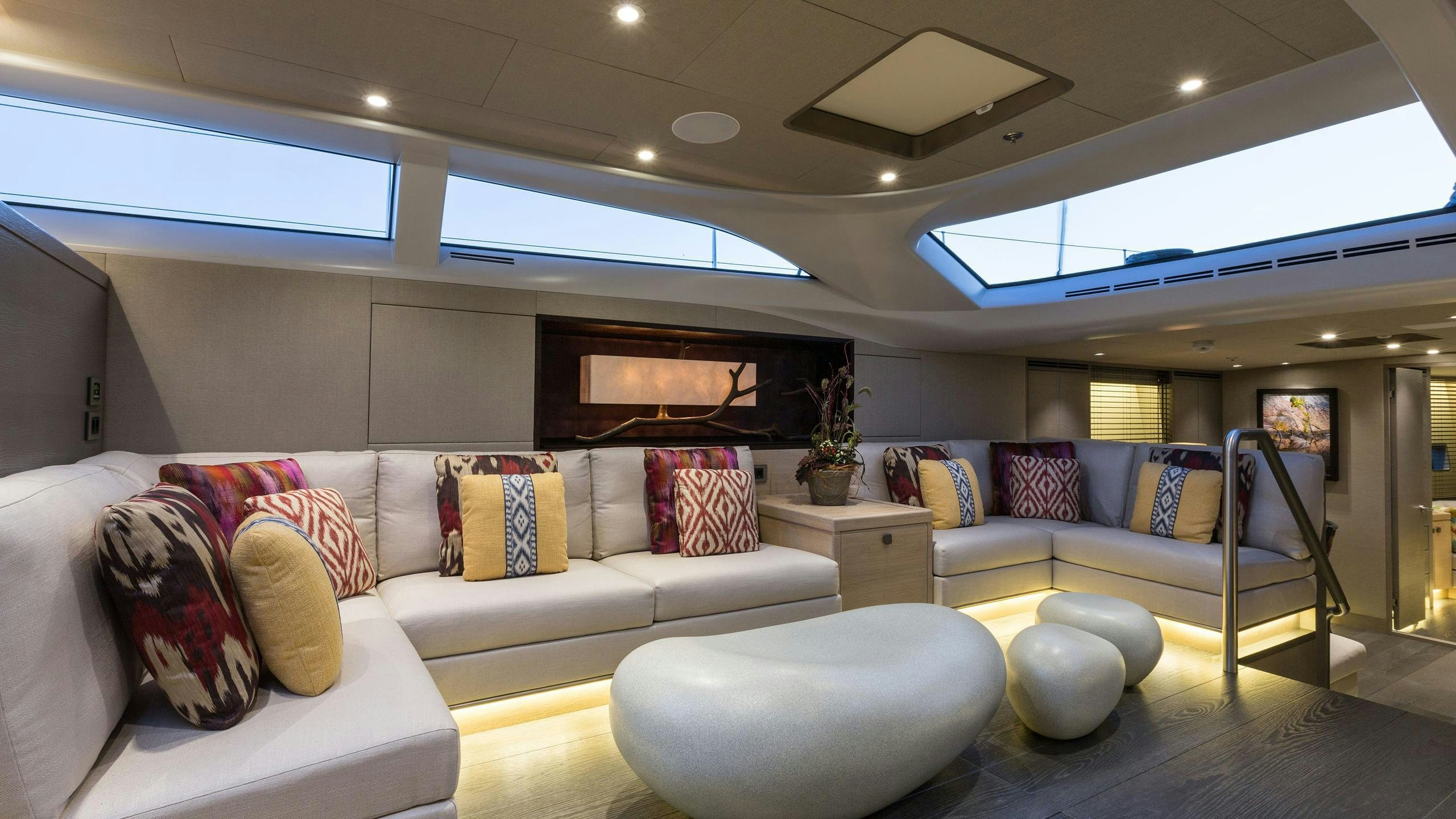a living room with a couch and a television aboard INUKSHUK Yacht for Charter