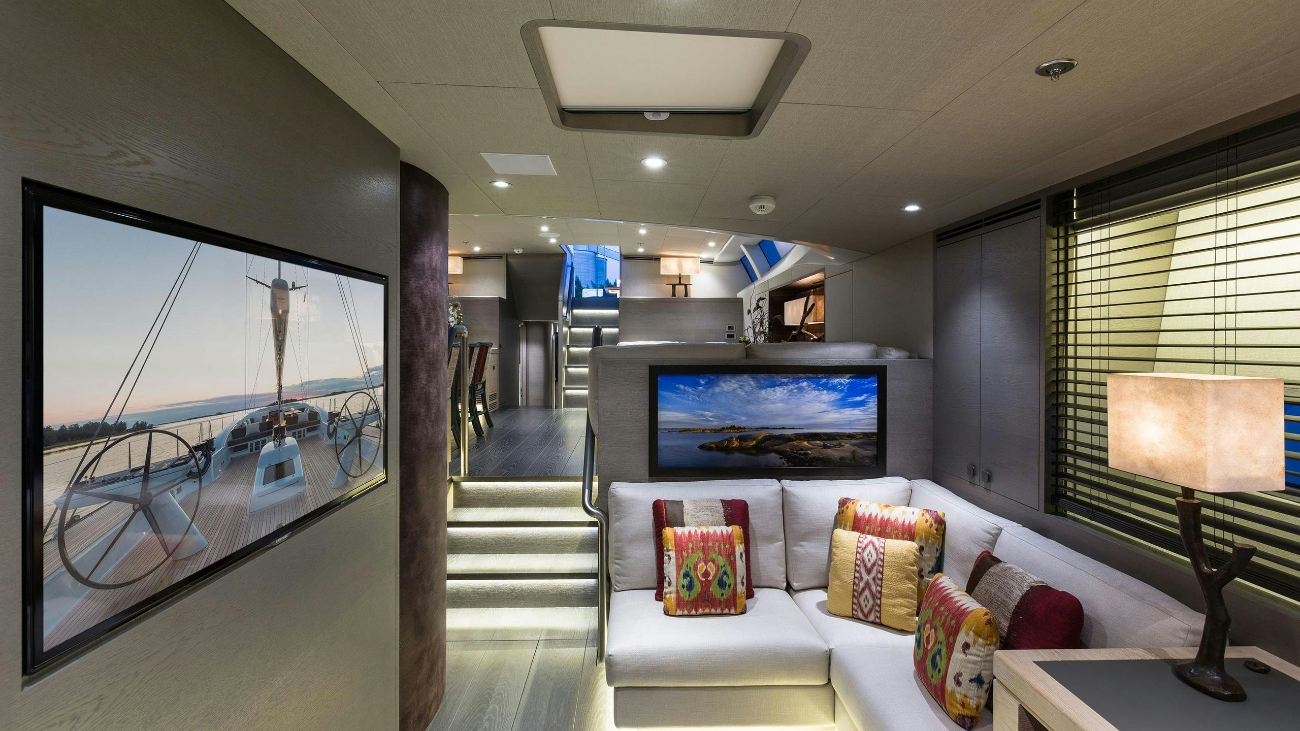 a room with a tv and a couch aboard INUKSHUK Yacht for Charter