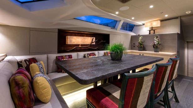 a living room with a table and chairs aboard INUKSHUK Yacht for Charter