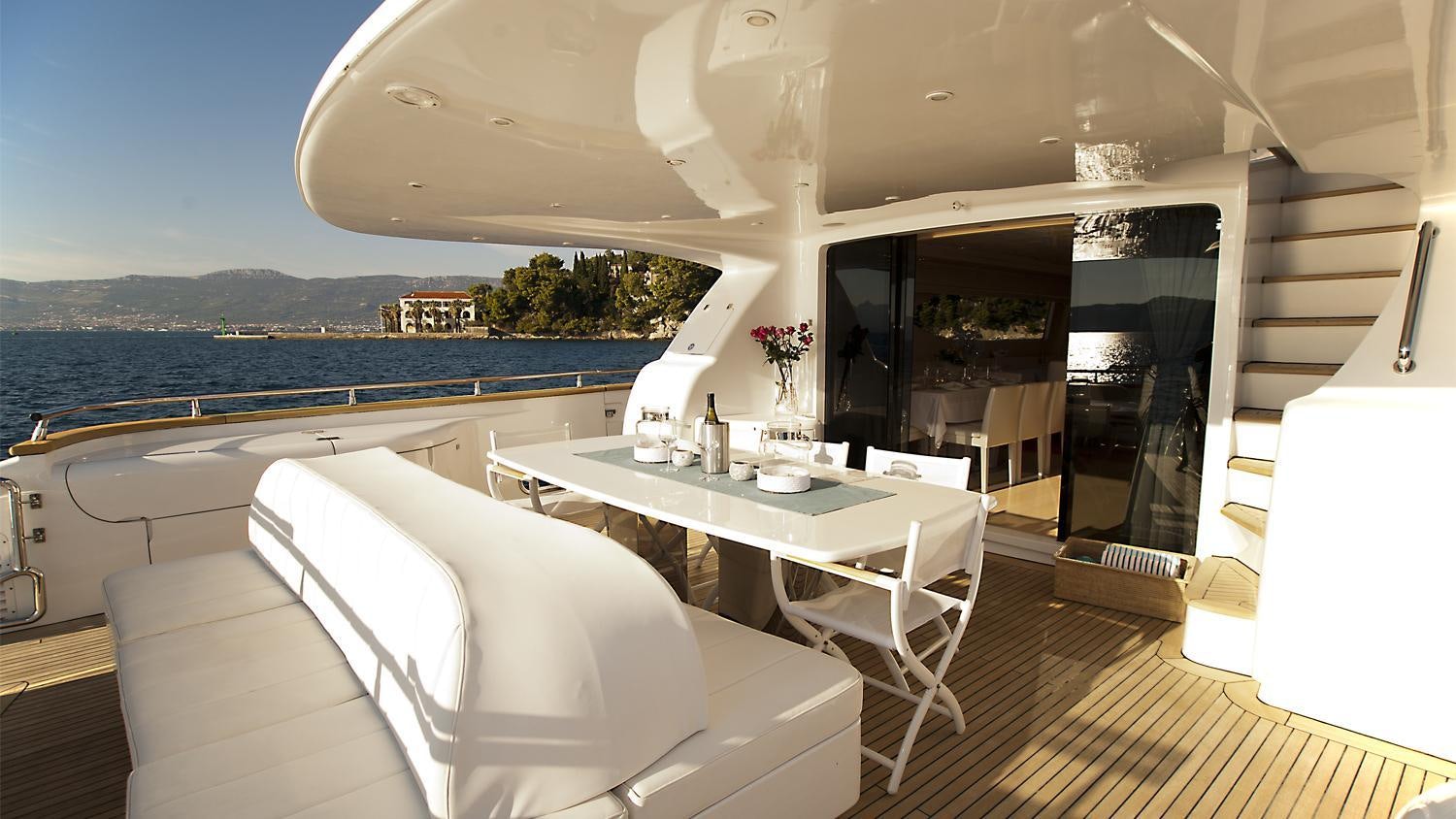 a room with a table and chairs aboard TUSCAN SUN Yacht for Charter