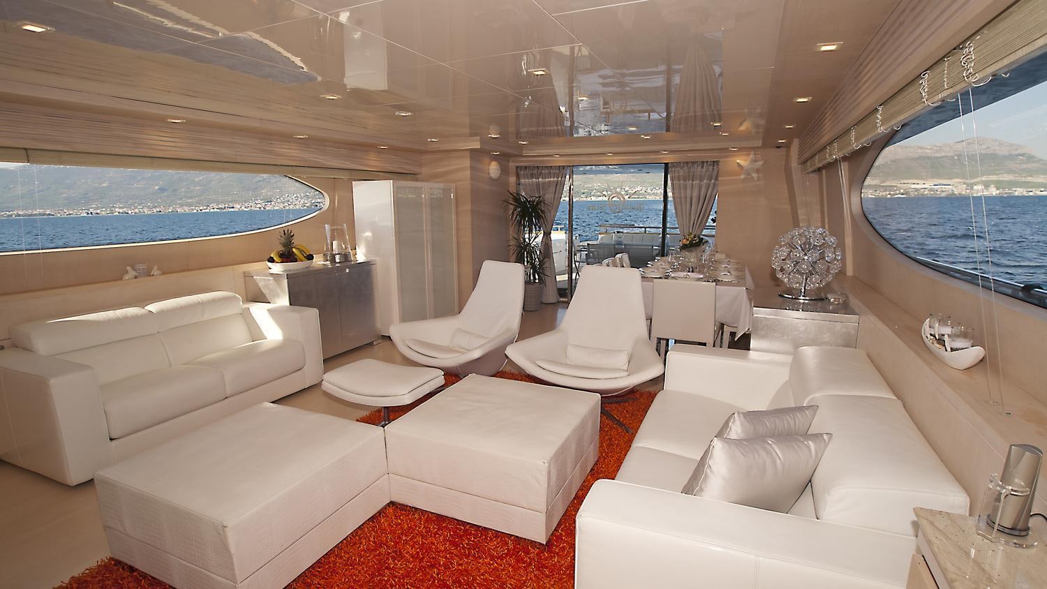 a room with a large window and a view of the ocean aboard TUSCAN SUN Yacht for Charter