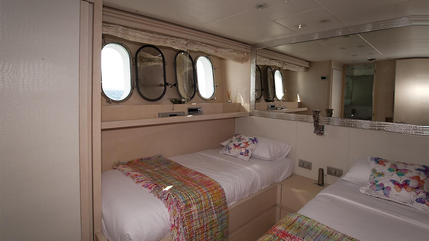a couple of beds in a room aboard TUSCAN SUN Yacht for Charter