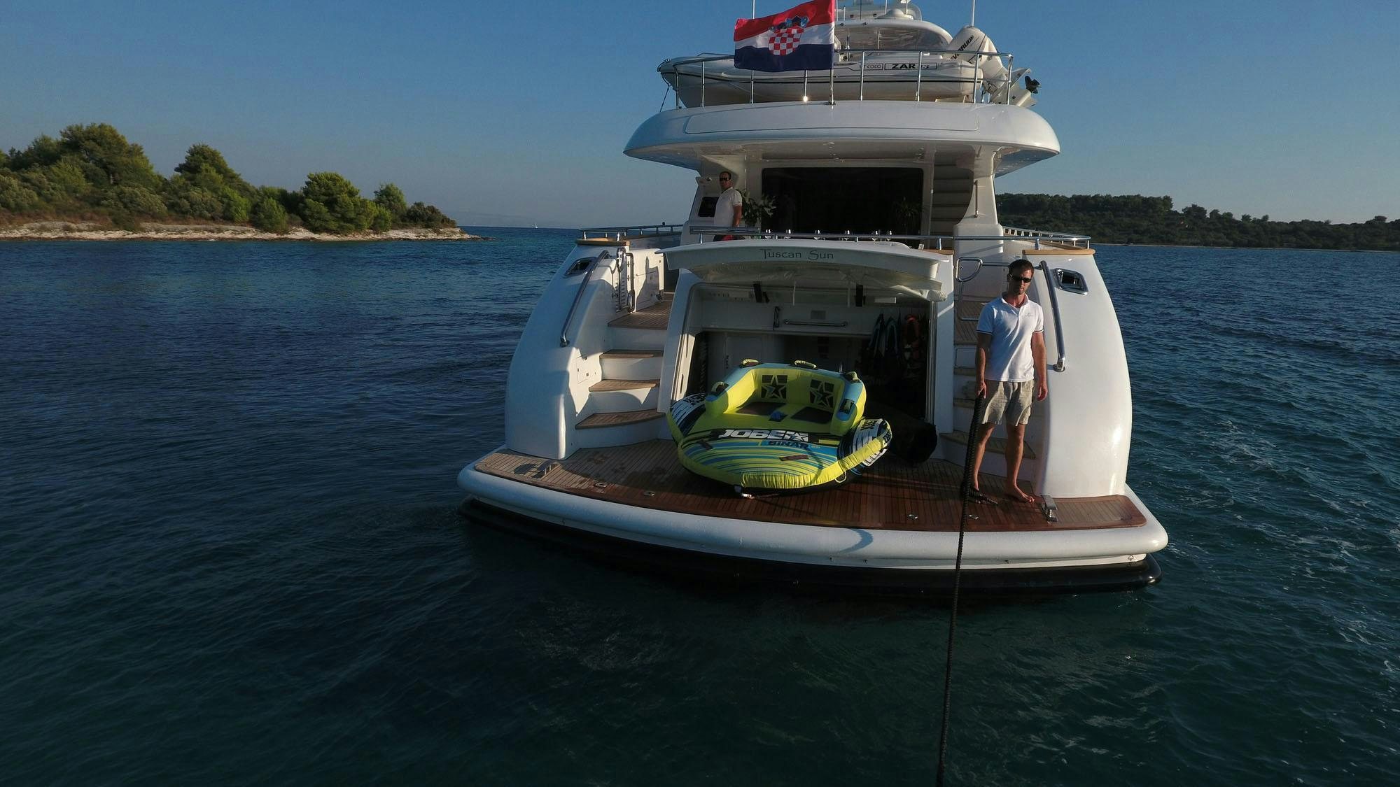 a person standing on a boat aboard TUSCAN SUN Yacht for Charter