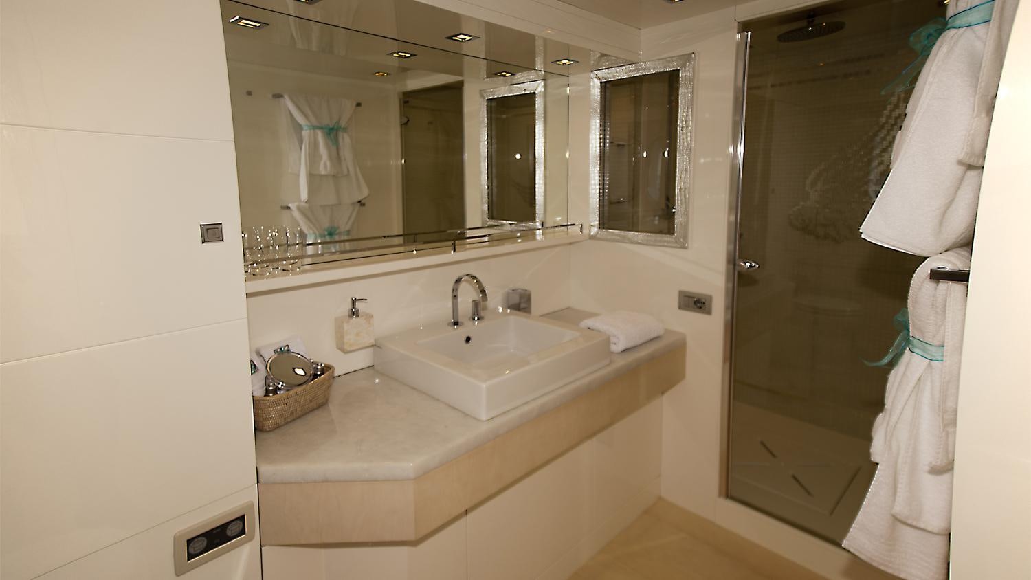 a bathroom with a sink and a mirror aboard TUSCAN SUN Yacht for Charter