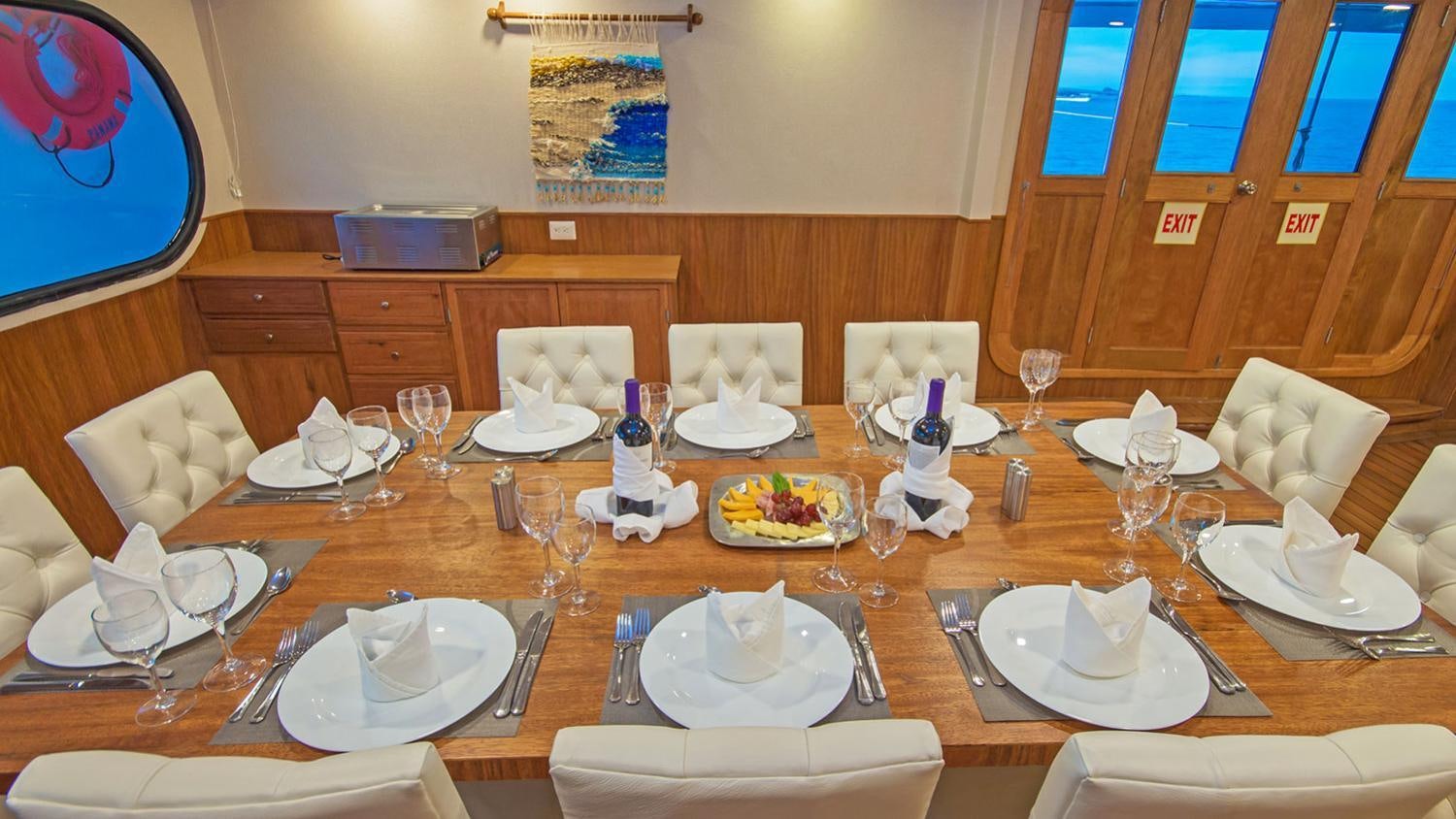 a table with plates and glasses aboard TIP TOP II Yacht for Charter
