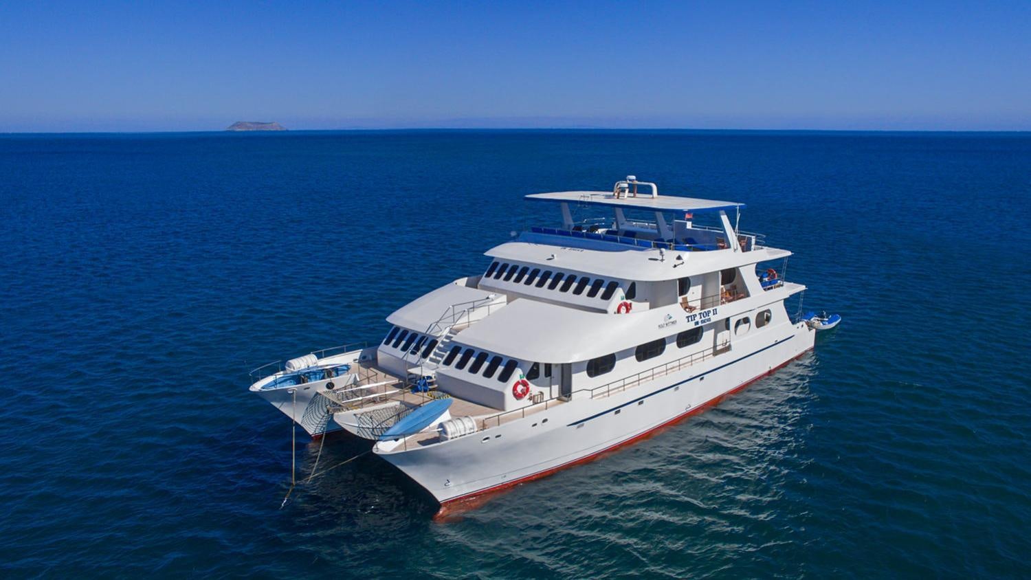 a large white ship in the water aboard TIP TOP II Yacht for Charter