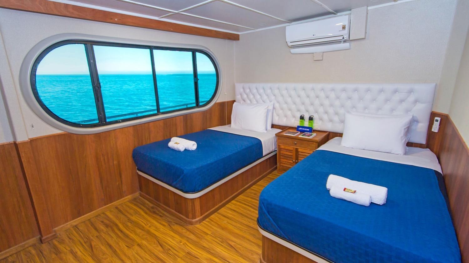 a room with two beds aboard TIP TOP II Yacht for Charter