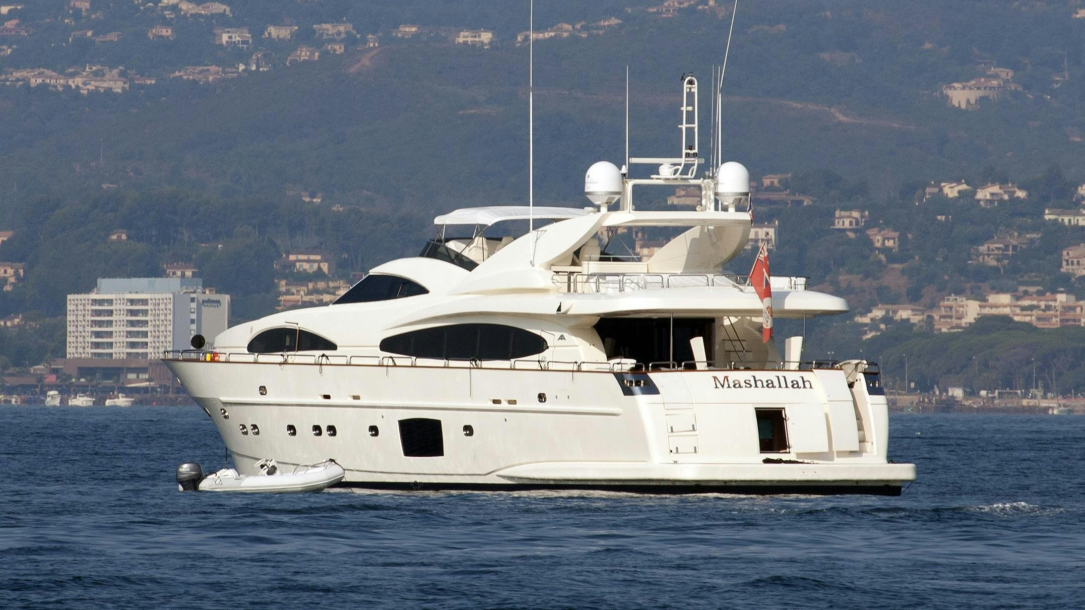 a white boat on the water aboard KIRIOS Yacht for Charter