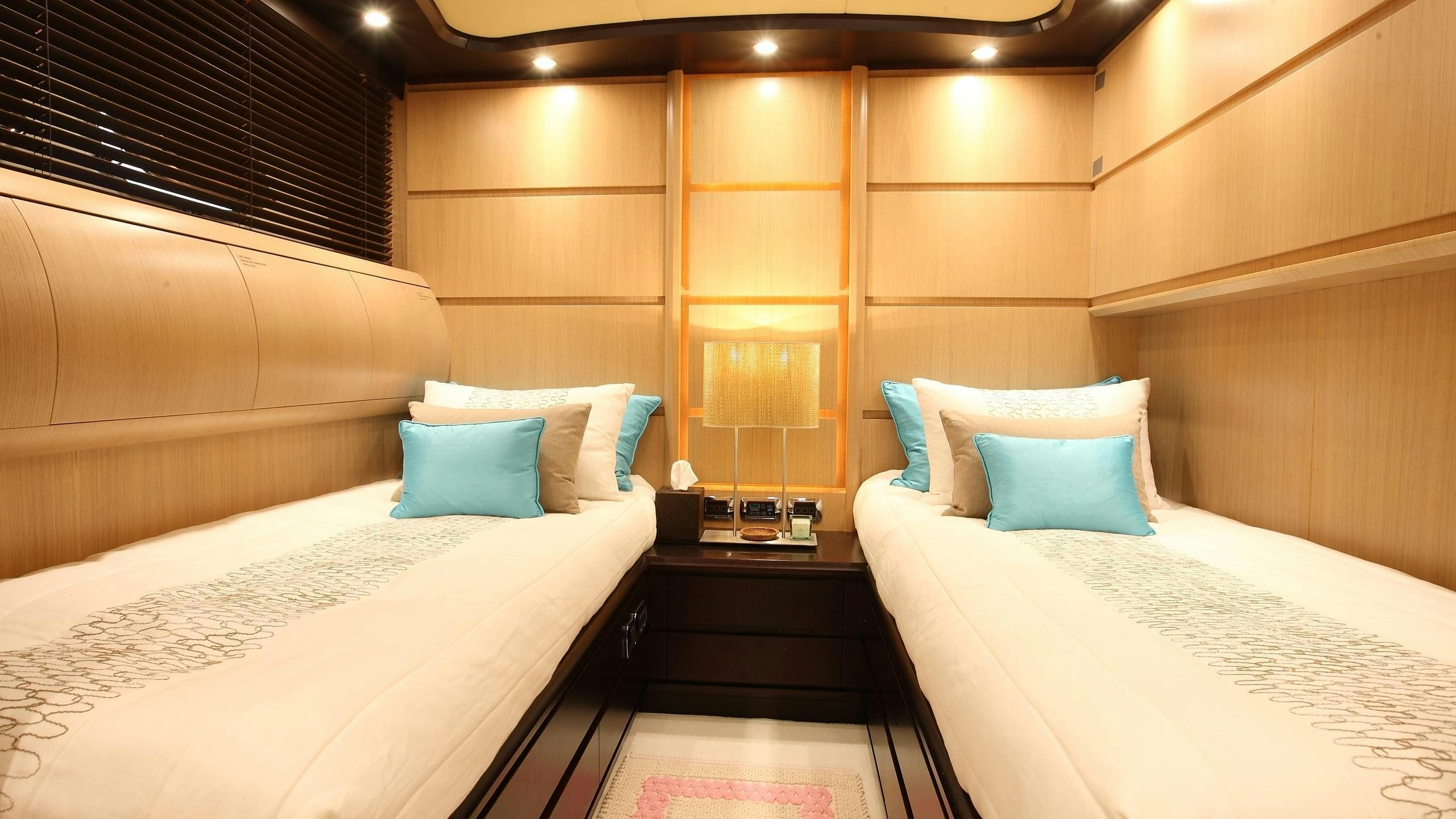 a room with two beds aboard DOLCE VITA IV Yacht for Charter