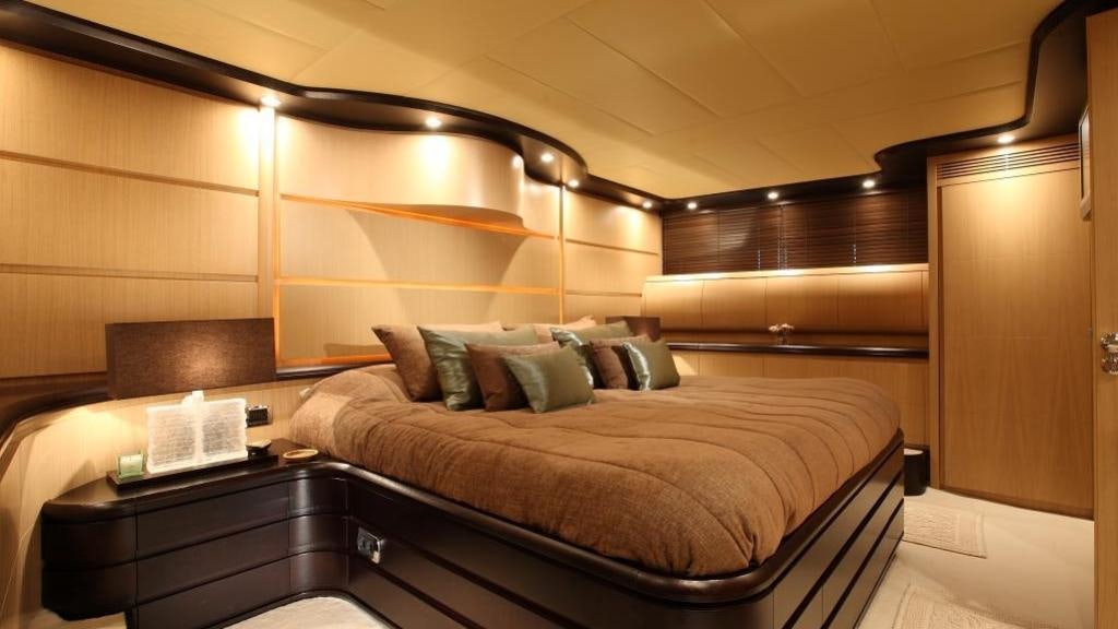 a bed in a room aboard KIRIOS Yacht for Charter