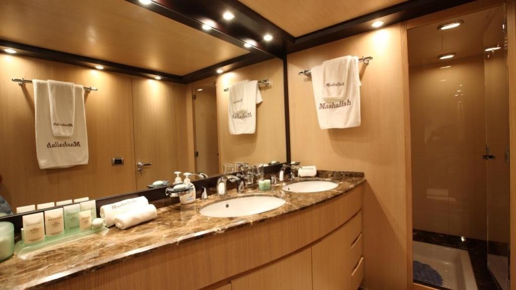 a bathroom with a large mirror aboard KIRIOS Yacht for Charter