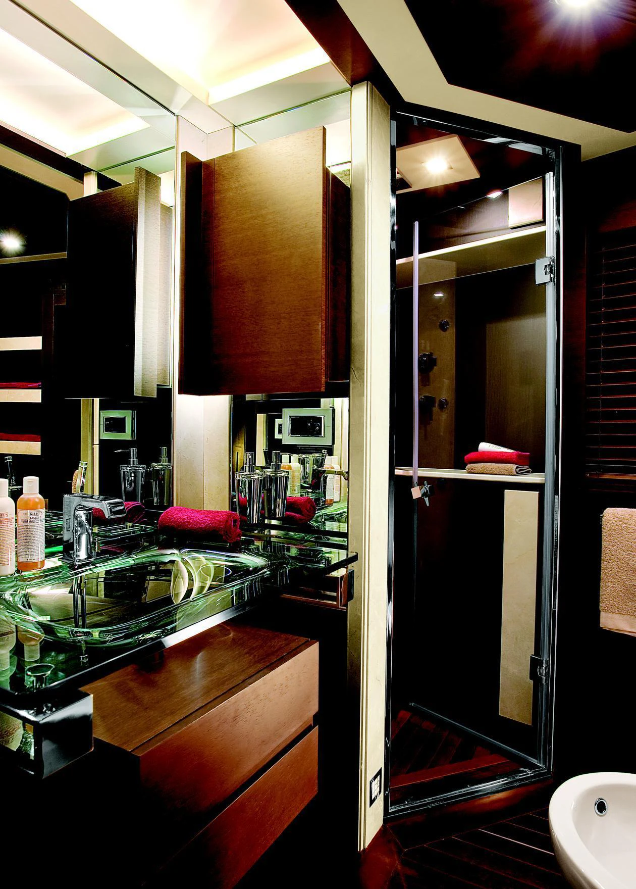 a kitchen with a sink and a refrigerator aboard DUKE Yacht for Charter