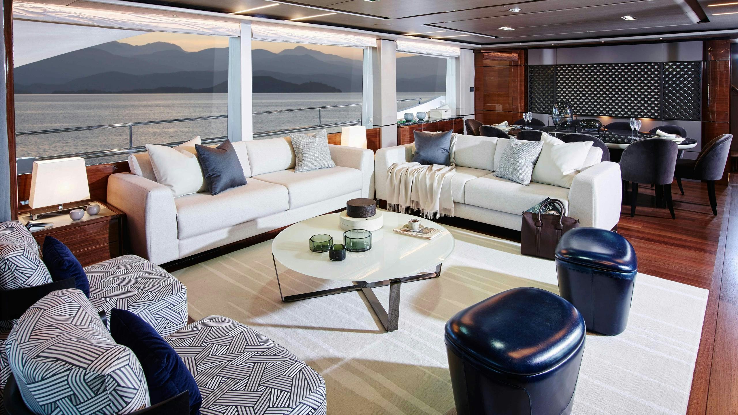 a living room with a couch and a table aboard KOHUBA Yacht for Charter