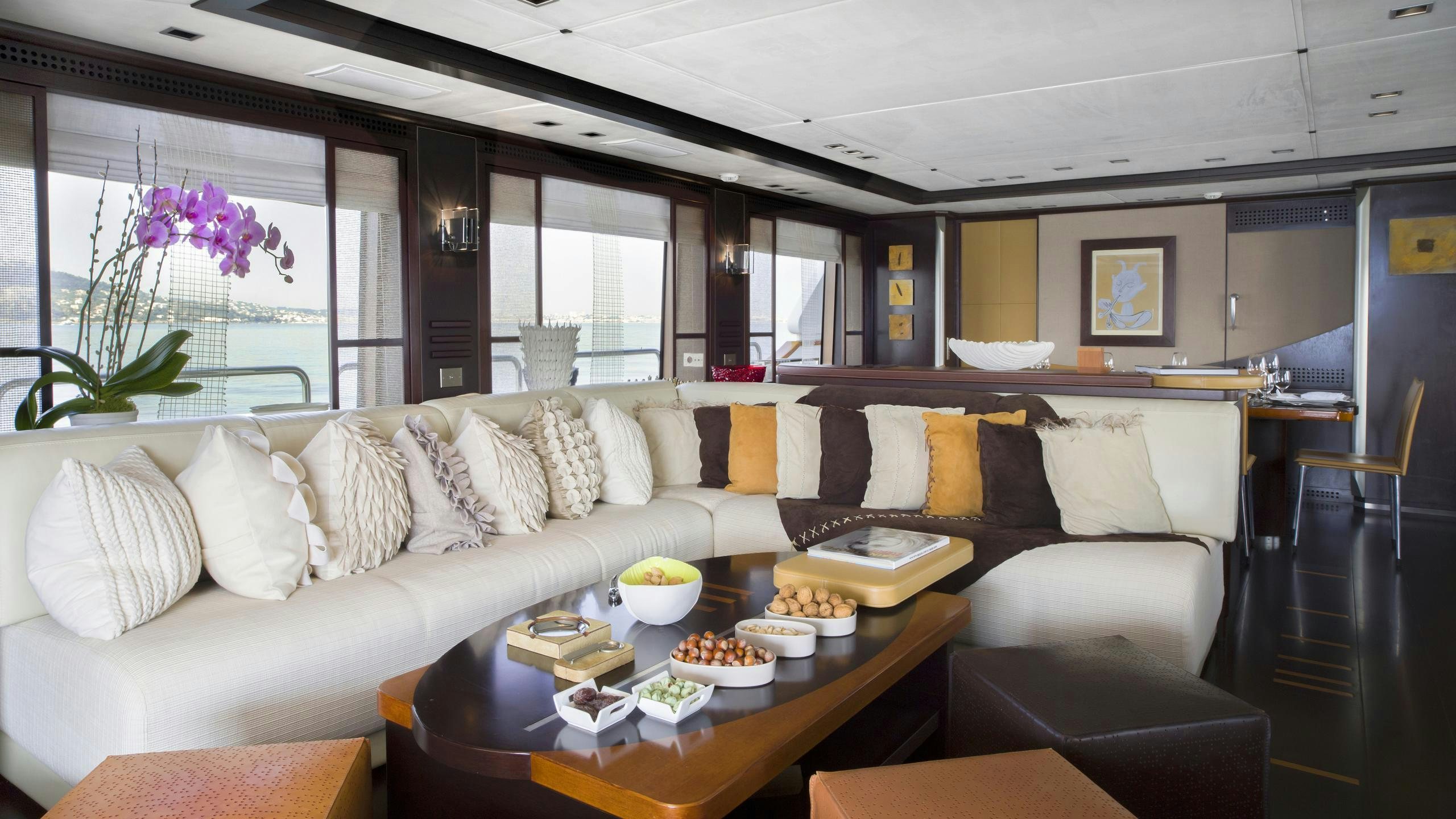 a living room with a couch and a table aboard QUID PRO QUO Yacht for Charter