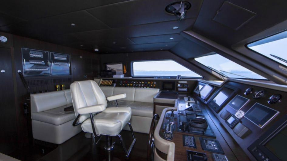 a room with computers and chairs aboard QUID PRO QUO Yacht for Charter