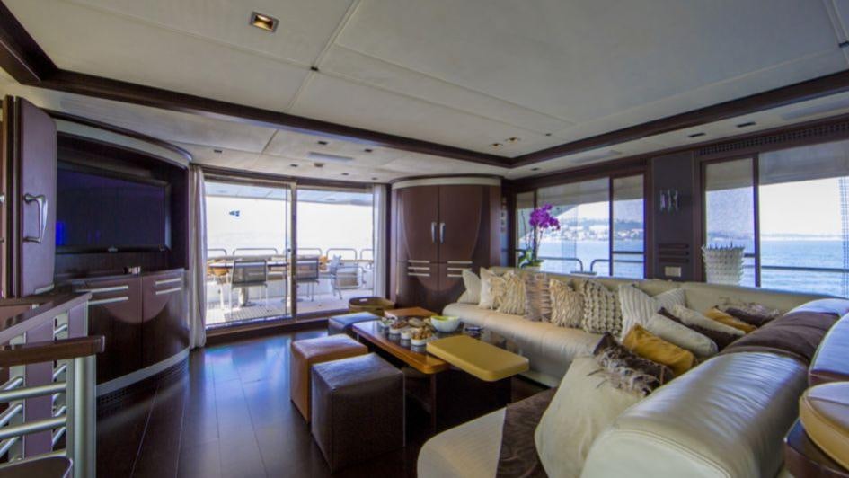 a living room with a large window aboard QUID PRO QUO Yacht for Charter