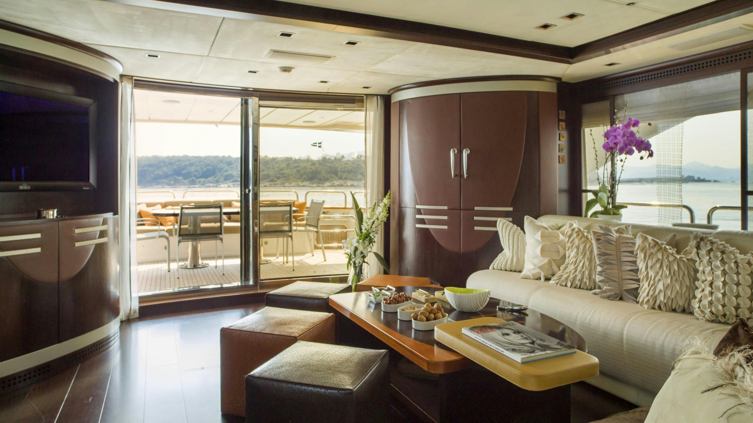 a living room with a large window aboard QUID PRO QUO Yacht for Charter