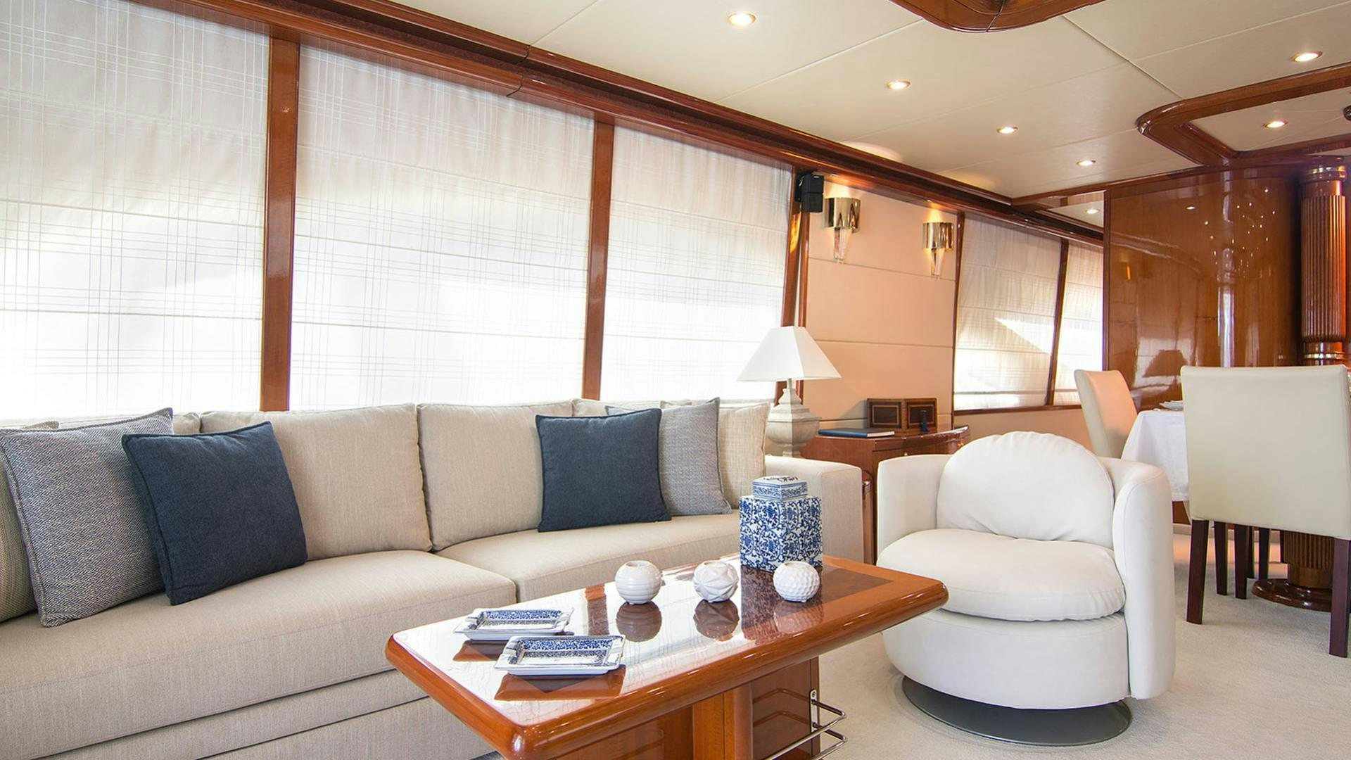 a living room with a couch and a table aboard DREAM B Yacht for Charter