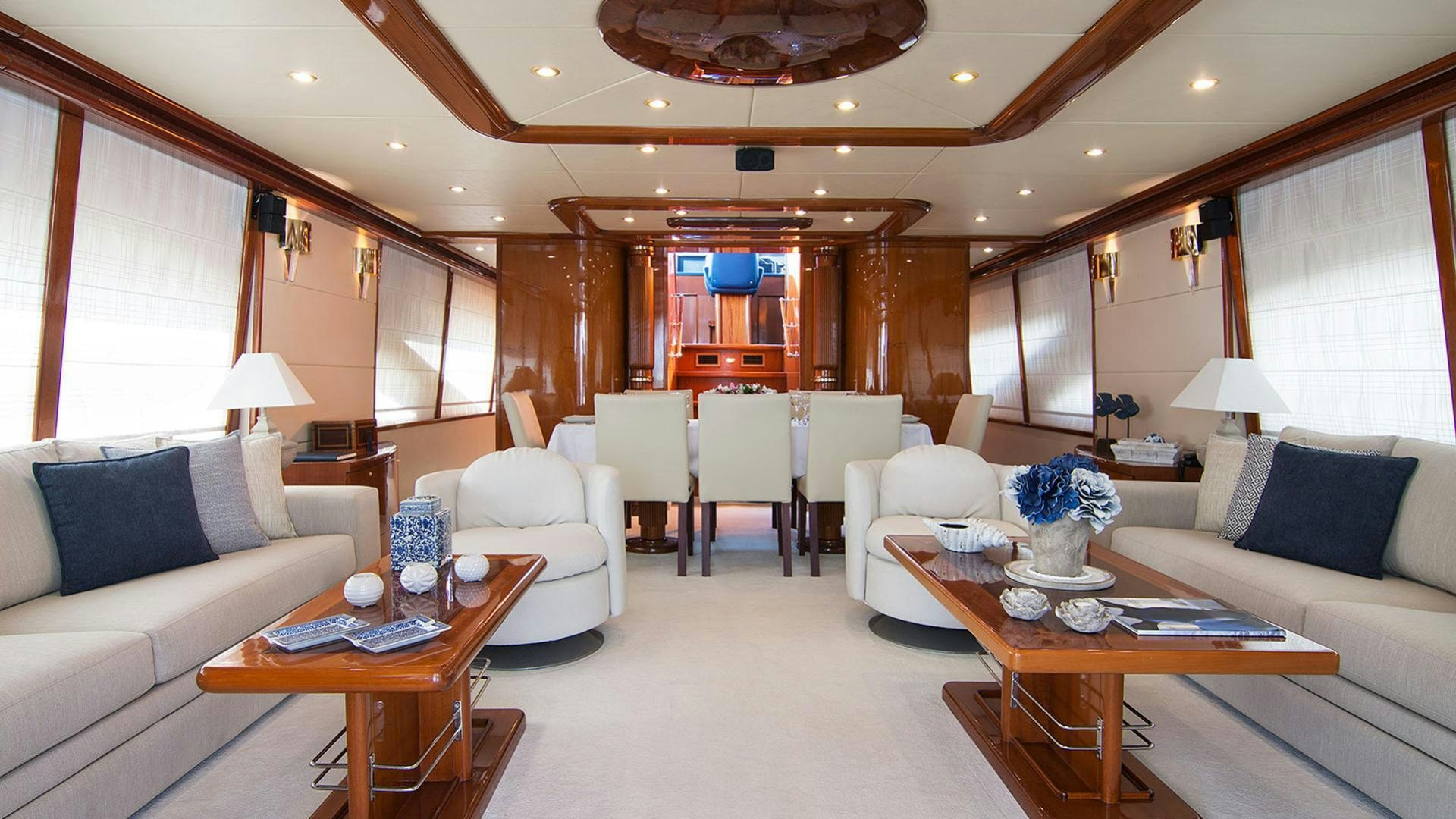 a living room with a couch and a coffee table aboard DREAM B Yacht for Charter