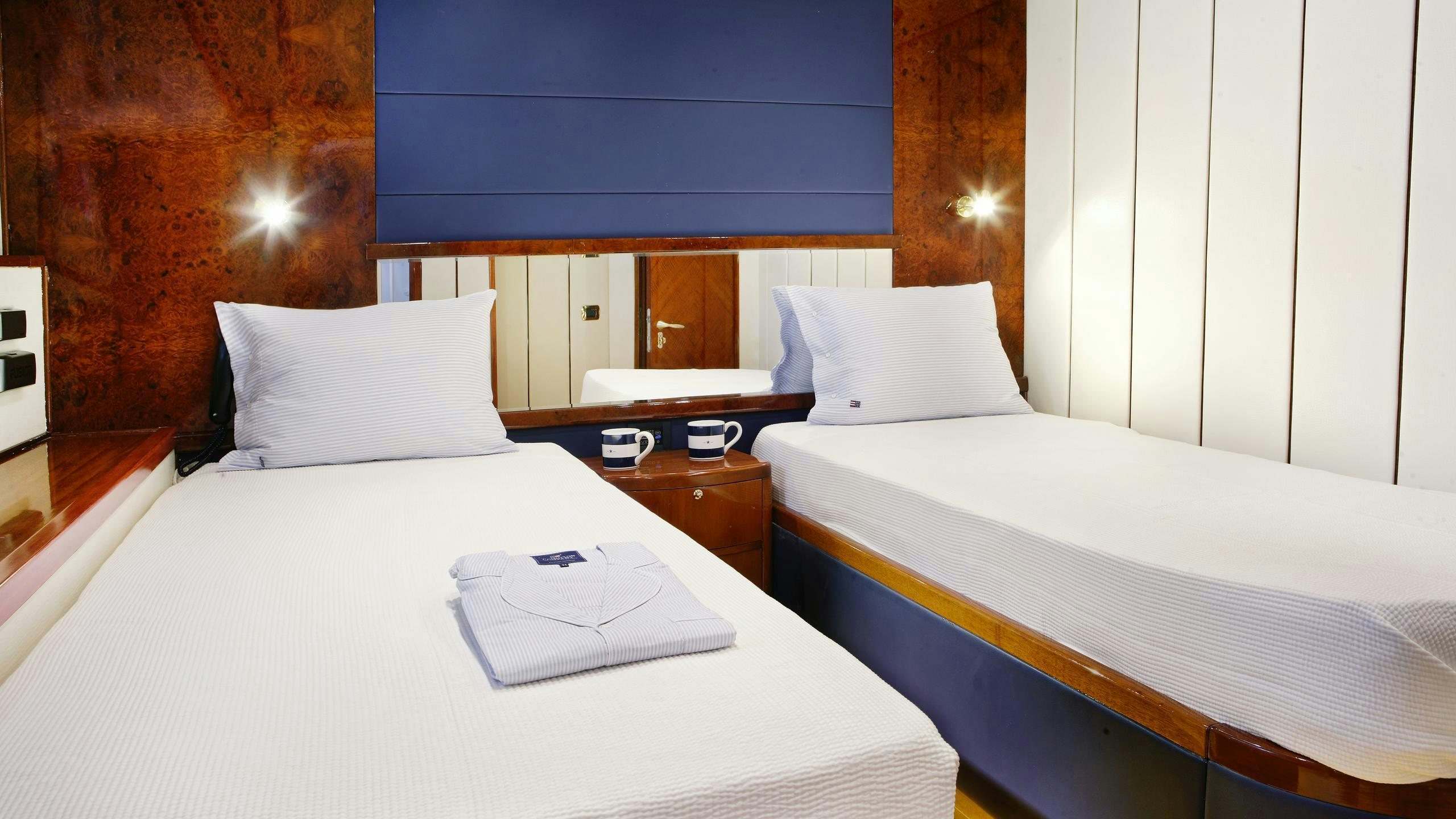 a couple of beds in a hotel room aboard DREAM B Yacht for Charter
