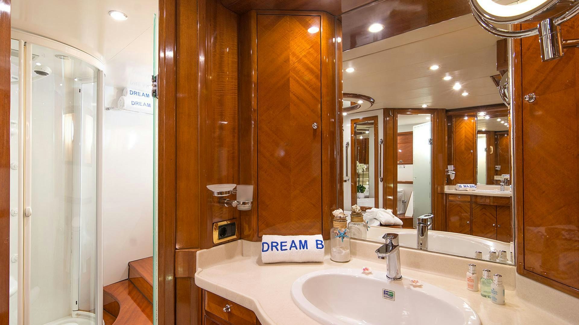 a bathroom with a large mirror aboard DREAM B Yacht for Charter