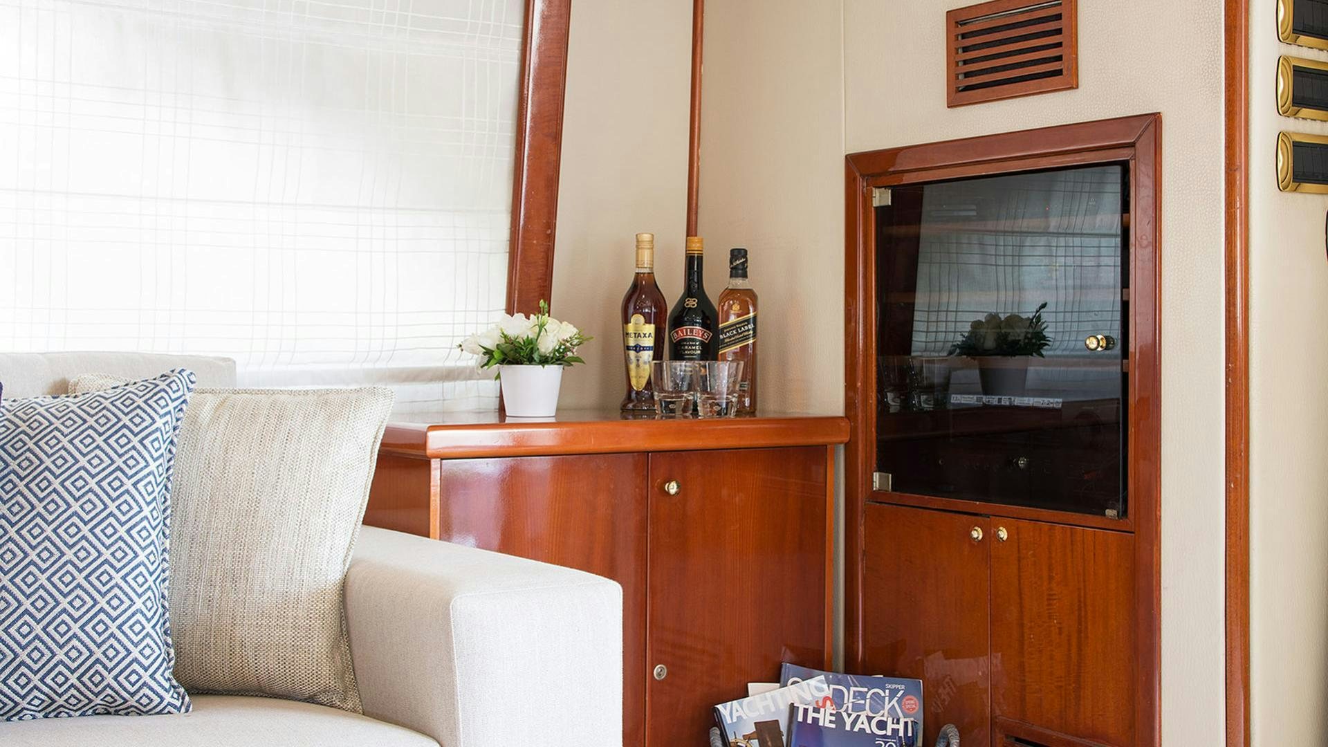 a living room with a fireplace aboard DREAM B Yacht for Charter
