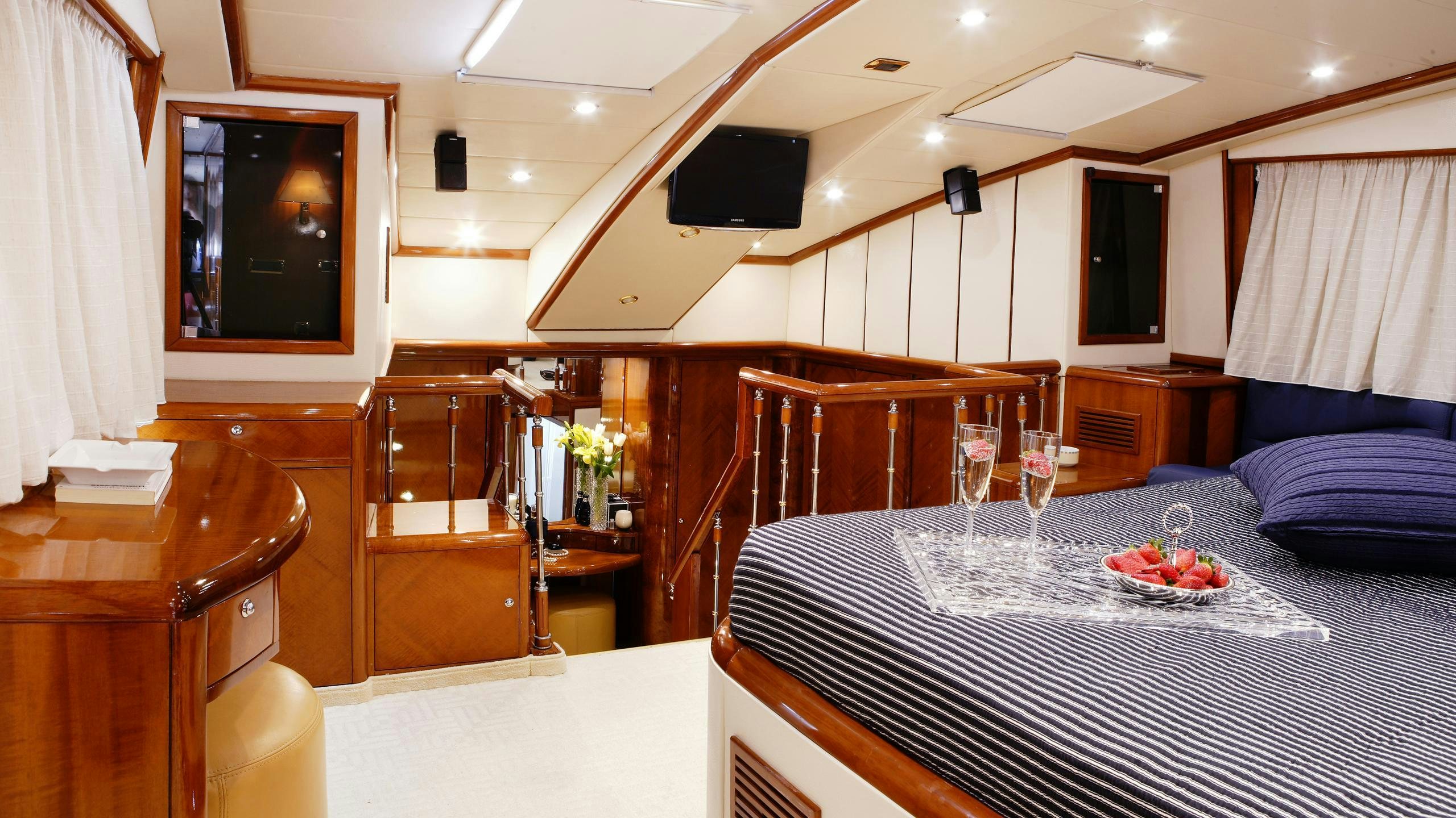 a room with a table and chairs aboard DREAM B Yacht for Charter