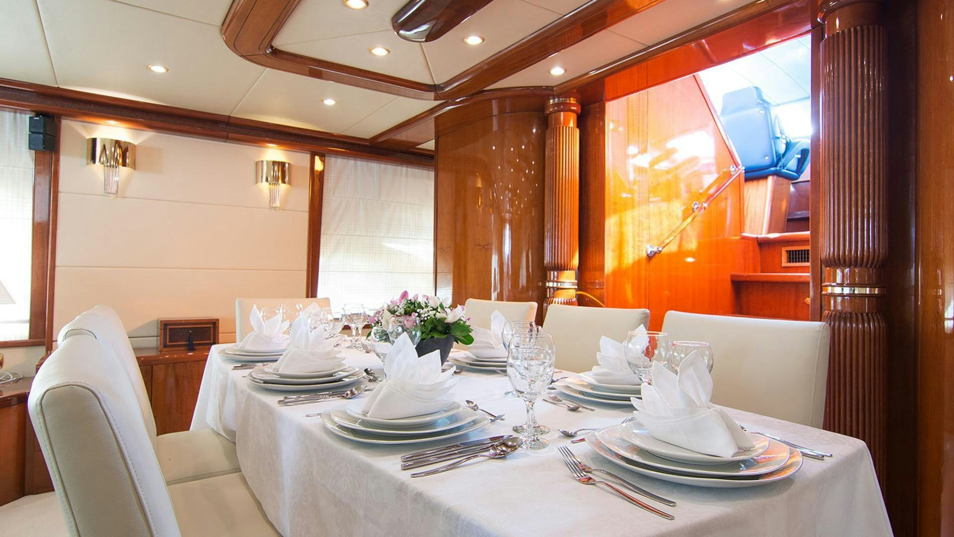 a table set for a dinner aboard DREAM B Yacht for Charter